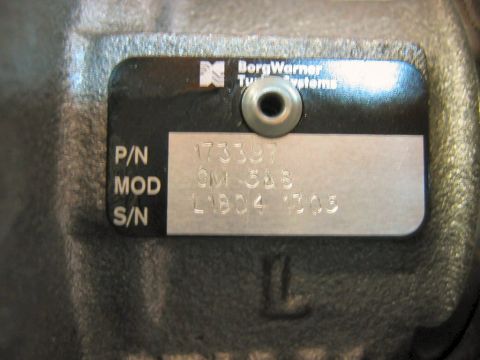 1985 Ford LTD Crown Victoria - Close-up of a BorgWarner turbocharger identification plate showing part and serial numbers.