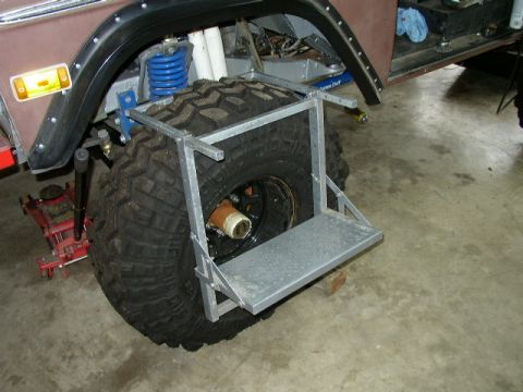 1995 Ford Bronco - Custom step mounted on a large off-road tire, likely for easier access to a modified vehicle.