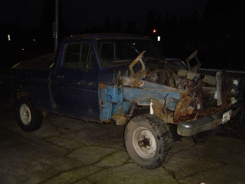 1979 Ford Bronco - This heavily rusted and damaged pickup truck is missing its front clip and appears to be a project vehicle.