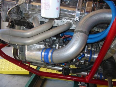 1993 Ford Taurus - Custom engine modifications with polished metal and blue hose accents are visible in this engine bay.