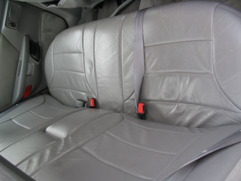 1993 Ford Taurus - Interior view of gray leather rear car seats and seat belts.