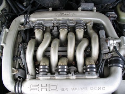 1993 Ford Taurus - Close-up of a Ford SHO 24 valve engine intake manifold, showing "SHO" and "24 VALVE" markings.