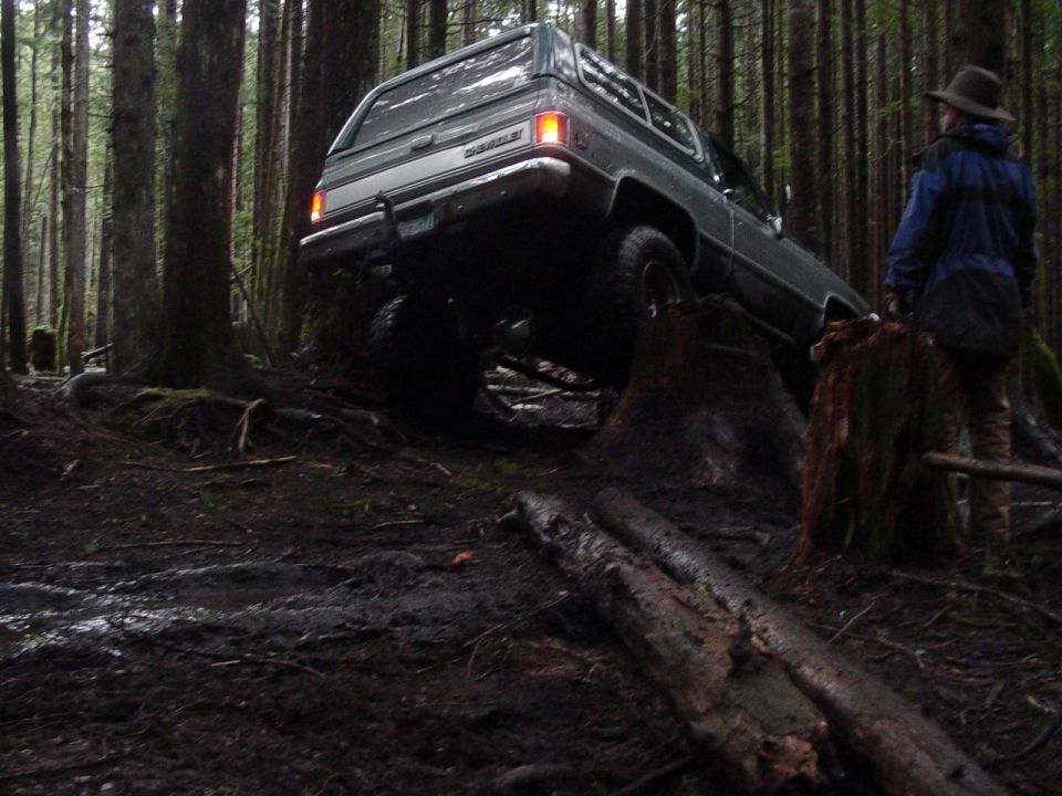 Gray Chevrolet K5 Blazer on wooded trail