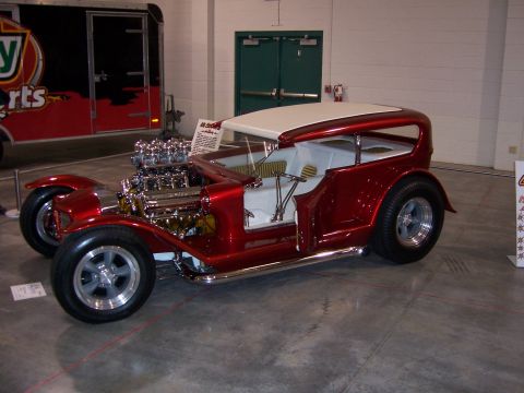 1999 Jeep TJ - Custom hot rod with a prominent V8 engine and a two-tone roof on display.