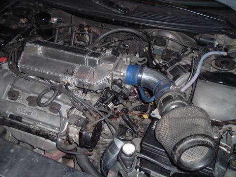 1994 Ford Probe - Close-up of a Ford engine a custom-fabricated intake manifold and a cone air filter.