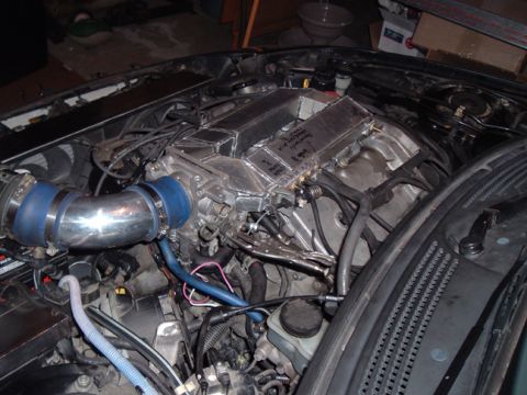 1994 Ford Probe - Custom intake manifold installed in an engine bay, with visible handwritten notes on the manifold.