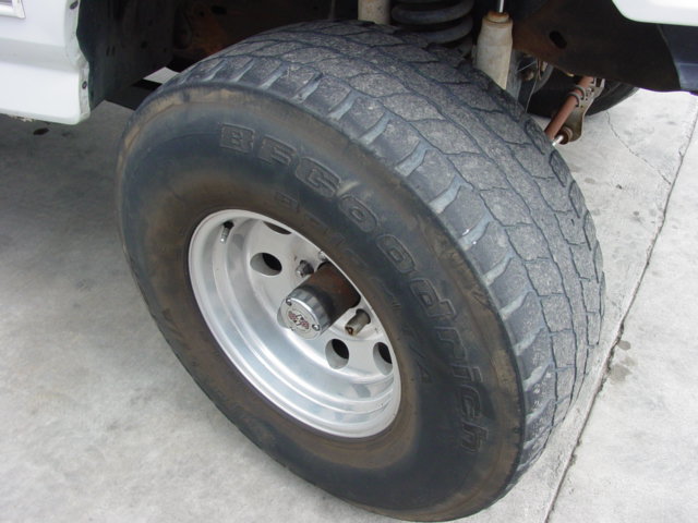 BFGoodrich All-Terrain T/A tire on a silver 5-spoke wheel, part of a vehicle
