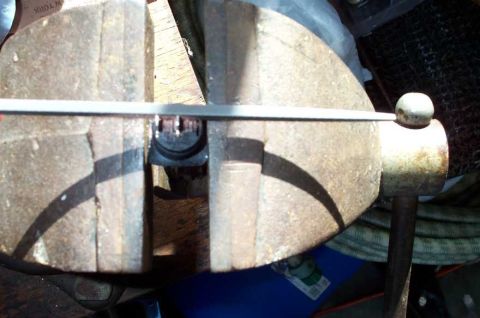1998 Ford Crown Victoria - In order for the new SPST flip switch to fit the OEM blade-style harness, I had to use a file to thin down the SPST's connector blades.