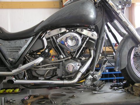 1995 Mercury Grand Marquis - Close-up view of a motorcycle's engine, chrome accents and exhaust system components.