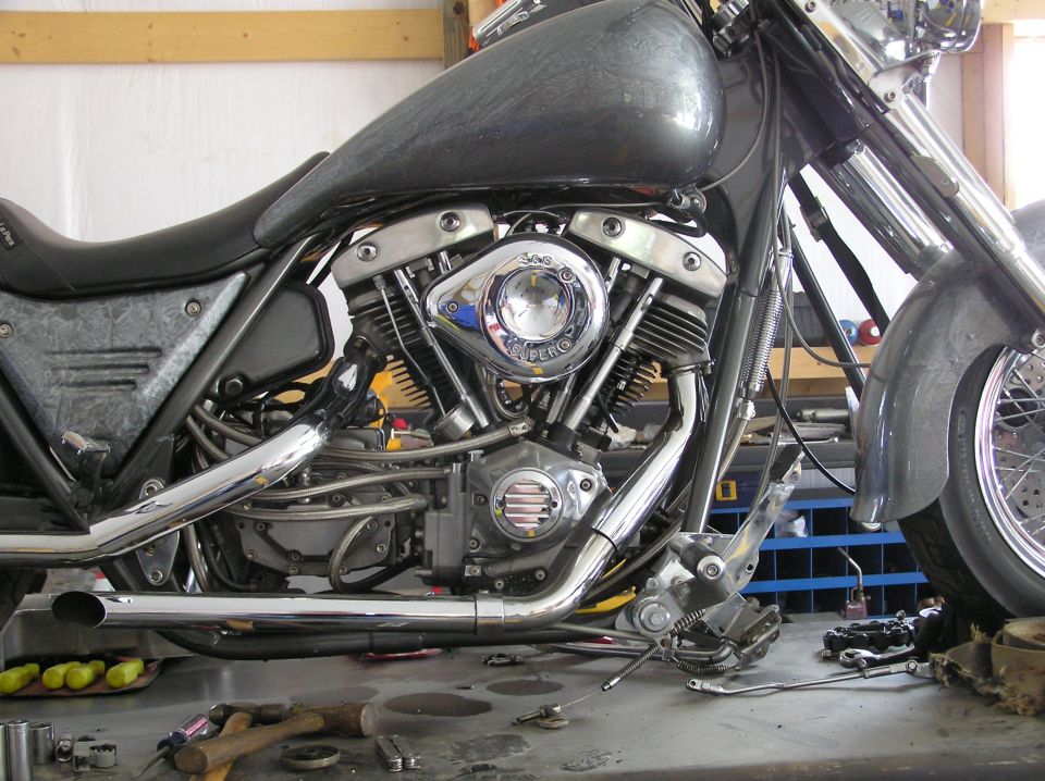 Motorcycle engine with chrome air cleaner and exhaust pipes