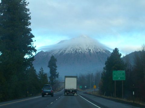 1993 Ford Bronco - Driving on a highway with a large mountain in the background and other vehicles on the road.