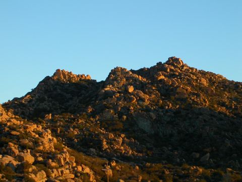 1993 Ford Bronco - The sun casts long shadows across a , rocky mountainside.