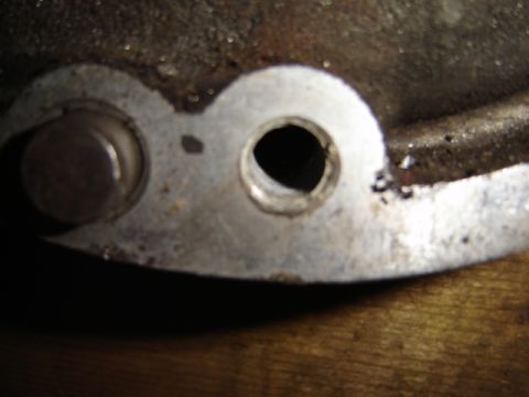1992 Ford Bronco - A close-up view of a metal component, likely from an engine, showing two distinct circular openings.