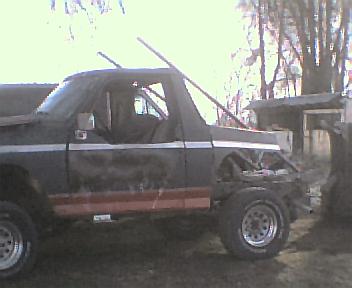 1983 Ford Bronco - This Ford Bronco appears to be undergoing repairs or modifications, with visible damage and missing components.