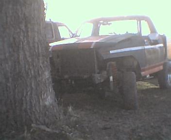 1983 Ford Bronco - This Ford truck appears to be in a state of disrepair, with its grille removed and parked outdoors.