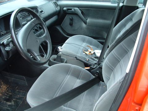 1994 Volkswagen Jetta - Interior view shows gray cloth seats, dashboard, and manual transmission shifter.