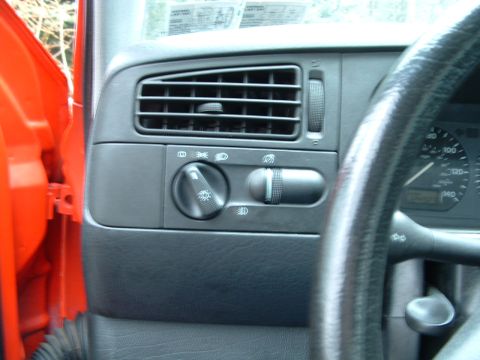 1994 Volkswagen Jetta - Close-up of a car's interior dashboard, focusing on the light controls and air vent.
