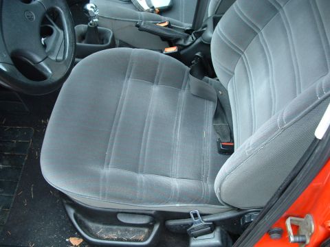 1994 Volkswagen Jetta - The interior of a car is shown, gray cloth seats and a manual transmission shifter.