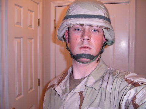 1988 Ford Bronco - A person in a military uniform and helmet is shown in a selfie-style photo.