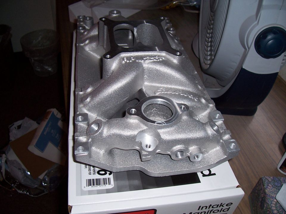 New Edelbrock aluminum small-block Chevy intake manifold resting on its cardboard box