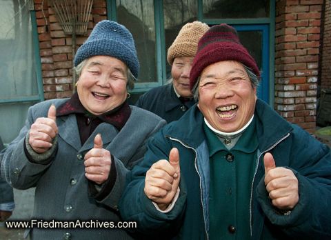 1996 Ford Bronco - Three women with joyful expressions give a double thumbs up. www.FriedmanArchives.com is visible.