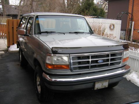 1992 Ford Bronco - This 1992 Ford Bronco is parked in a driveway during winter. It has a chrome grille and bumper.
