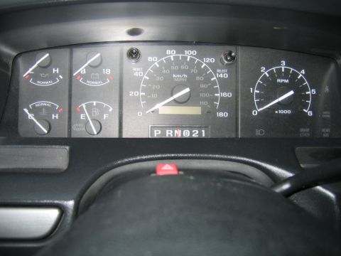 1992 Ford Bronco - Dashboard gauges for a 1992 Ford Bronco display speed, RPM, fuel level, oil pressure, and engine temperature.