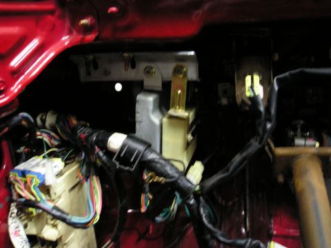 1994 Ford Probe - Close-up view of a complex vehicle interior wiring harness, showing numerous colorful wires and connectors.