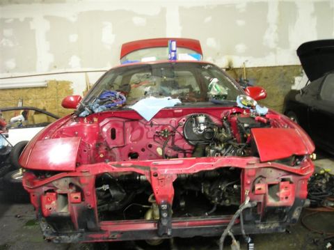 1994 Ford Probe - Front end of a 1994 Ford Probe removed for project work in a garage.