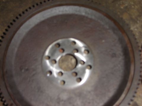 1992 Ford Bronco - Flywheel part shown in detail, with a central bolt pattern and outer ring gear visible.