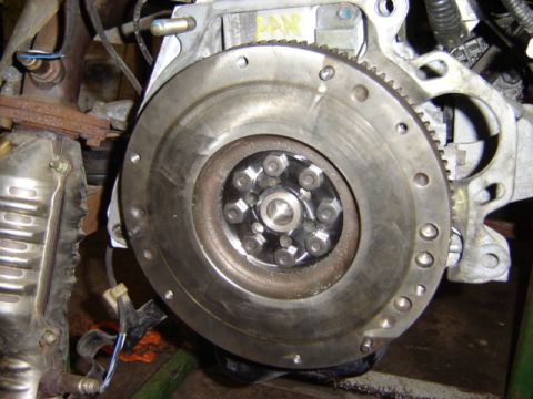 1992 Ford Bronco - Close-up view of an engine's flywheel and surrounding components.