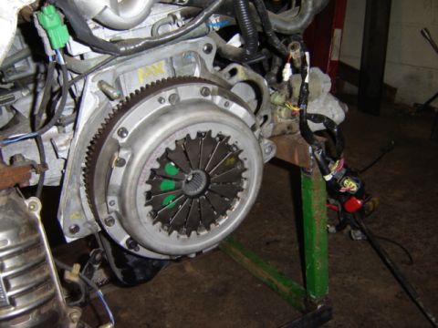 1992 Ford Bronco - Close-up view of a vehicle's clutch assembly, highlighting the pressure plate and flywheel teeth.
