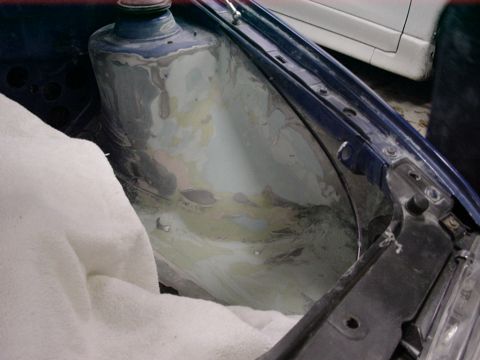 1998 Volkswagen Jetta - This image shows the interior of a car's fender well, likely undergoing bodywork or repair.