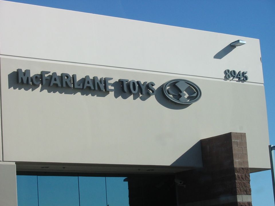 Building exterior with McFarlane Toys logo and address 8945