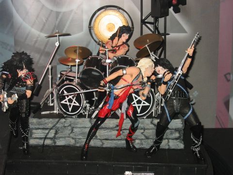 1991 Ford Bronco - A band of action figures performs on a stage, complete with a drum set and a large gong.