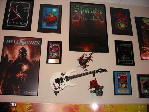 1991 Ford Bronco - Collection of Spawn-themed artwork and memorabilia displayed on a wall.