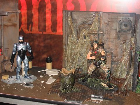 1991 Ford Bronco - This diorama depicts a scene with action figures, including RoboCop and a soldier, alongside an alien egg.