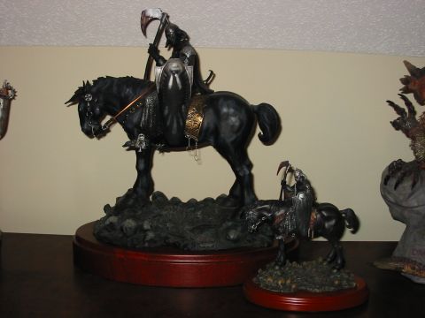 1991 Ford Bronco - Figurines of grim reapers on horseback are displayed on a shelf.