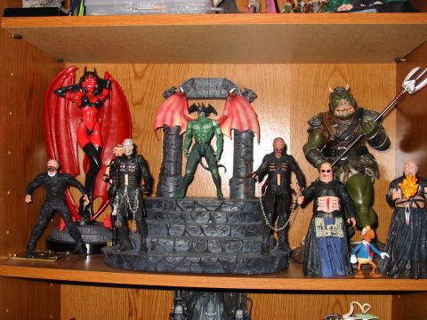 1991 Ford Bronco - A collection of various horror-themed action figures are displayed on a wooden shelf.