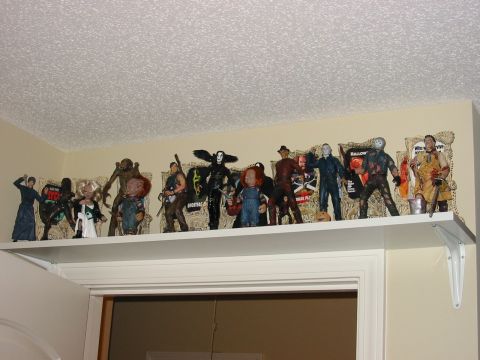 1991 Ford Bronco - Shelf displays various horror movie character action figures, including Chucky and Michael Myers.