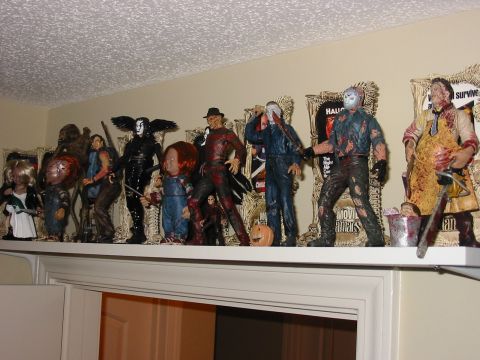 1991 Ford Bronco - A collection of iconic horror movie character figurines are displayed on a shelf.