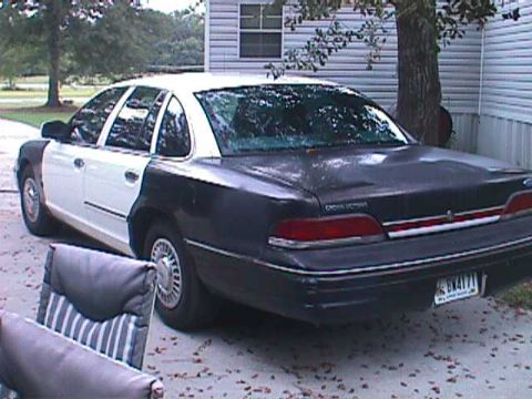1994 Ford Crown Victoria - This 1994 Ford Crown Victoria has a two-tone paint scheme with a black rear and white front.