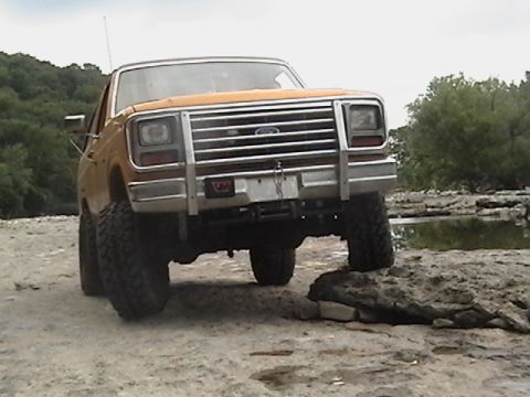 1986 Ford Bronco - This 1986 Ford Bronco is shown in a front-facing view, its distinctive chrome grille and bull bar.