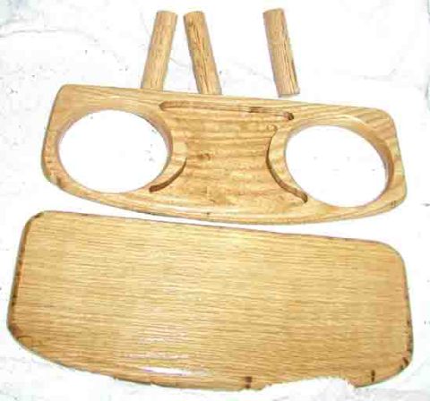 1988 Ford Bronco - This wooden dashboard part features two circular cutouts for cup holders and three wooden dowels protruding from the top.