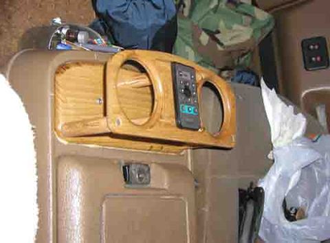 1988 Ford Bronco - Custom dashboard modification a wood-grain panel with cup holders and a remote.