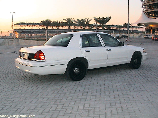 White 1999 Mercury Grand Marquis sedan, rear 3/4 view