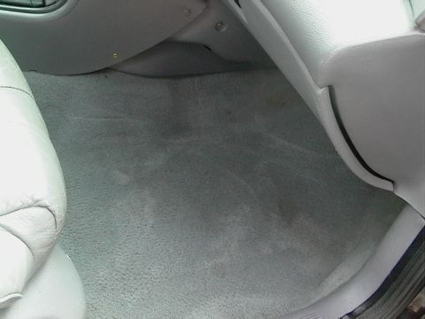 1995 Ford Contour - The interior floor and lower dashboard area of a car are visible in this photograph.