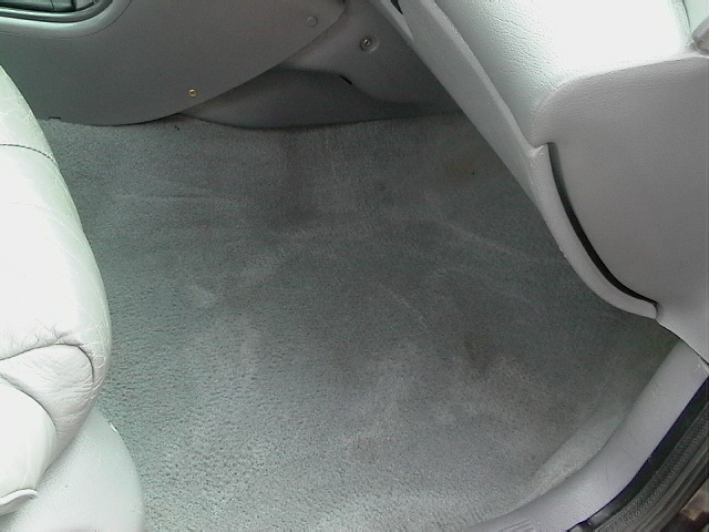 Interior floor and lower dashboard of a car