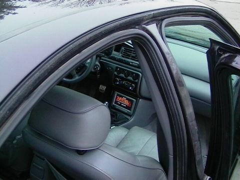 1995 Ford Contour - Interior view of a 1995 Ford Contour, highlighting the dashboard and seating area.