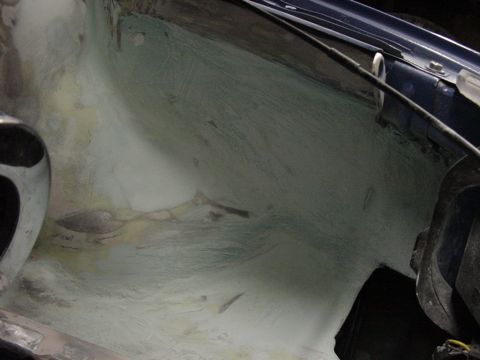 1998 Volkswagen Jetta - Underside of a car's engine bay showing repair work.